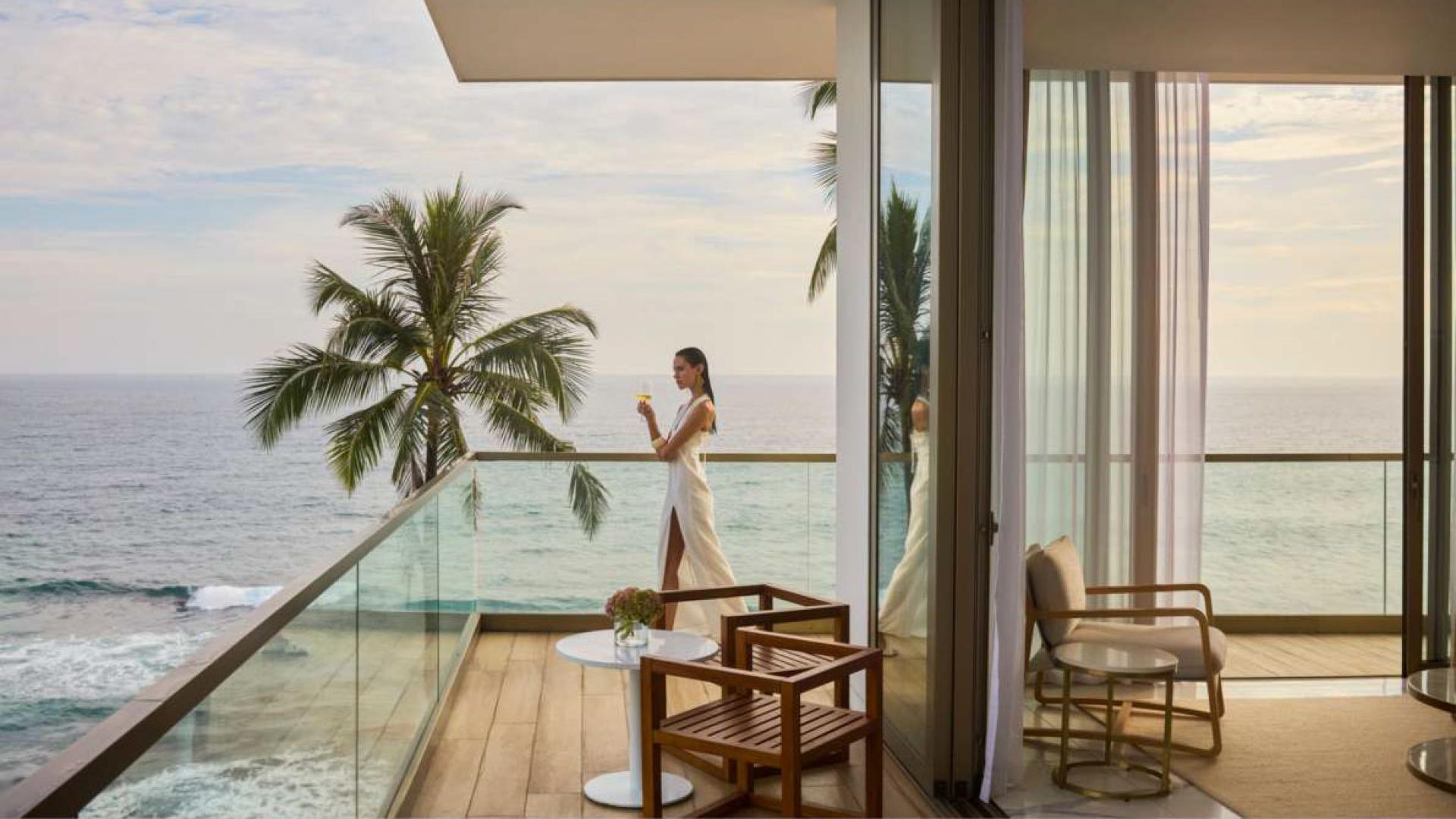 "Luxury penthouse living room with ocean view in Talpe Unawatuna, Galle District.","Luxury penthouse balcony with ocean view in Talpe Unawatuna, Galle District, Sri Lanka.",Luxurious walk-in closet in duplex penthouse, Talpe Unawatuna, Galle District