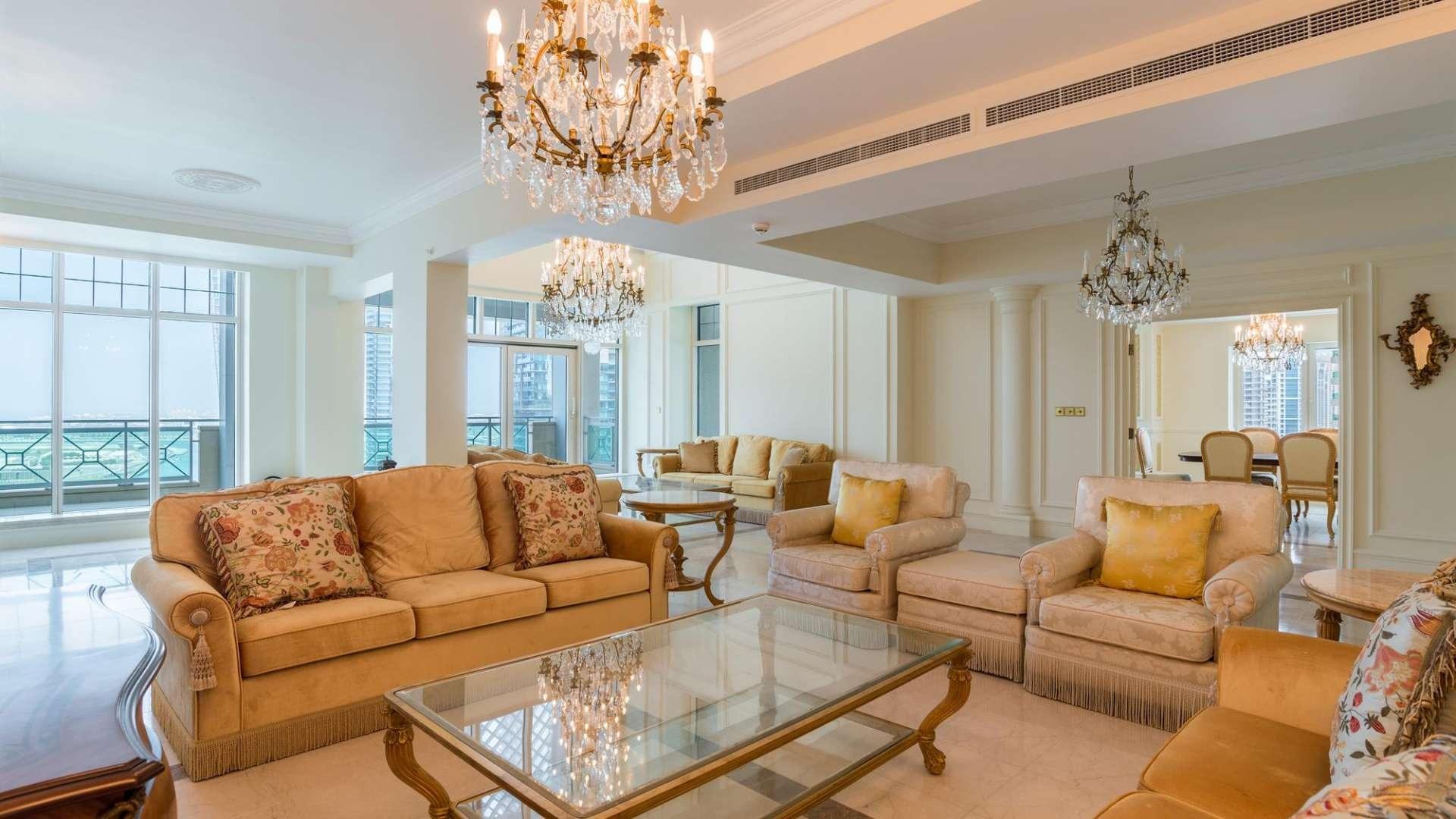Luxurious living room in Al Anbar Tower penthouse, Dubai Marina, elegant chandeliers, spacious seating