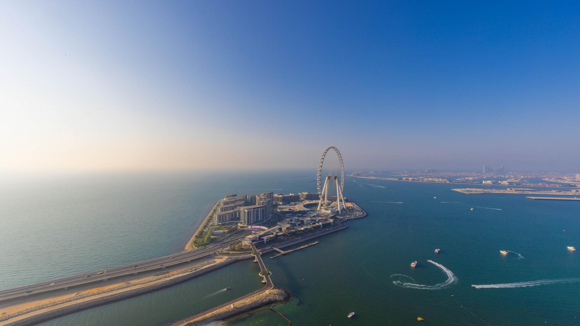 Luxurious penthouse terrace with modern seating and stunning Jumeirah Beach views