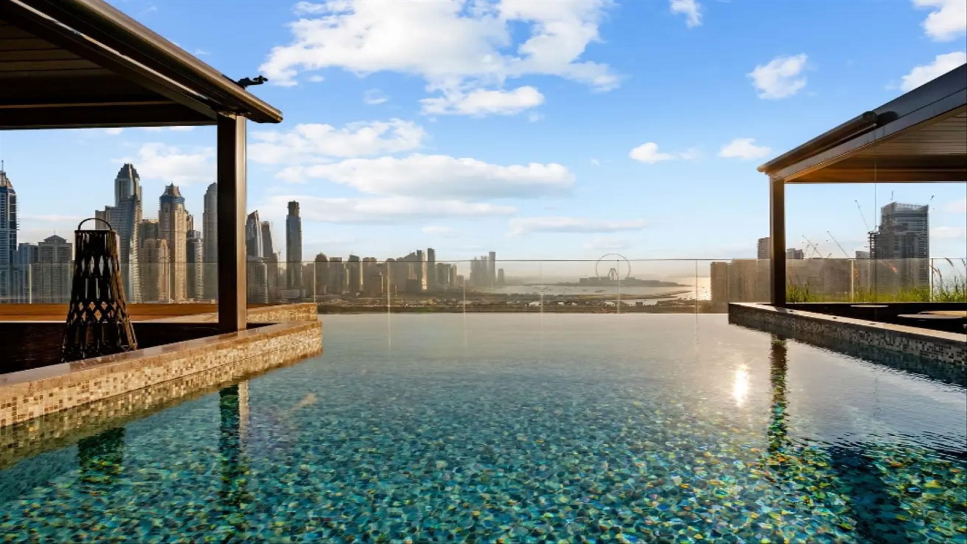 Penthouse terrace view of Dubai skyline and waterfront at One at Palm Jumeirah