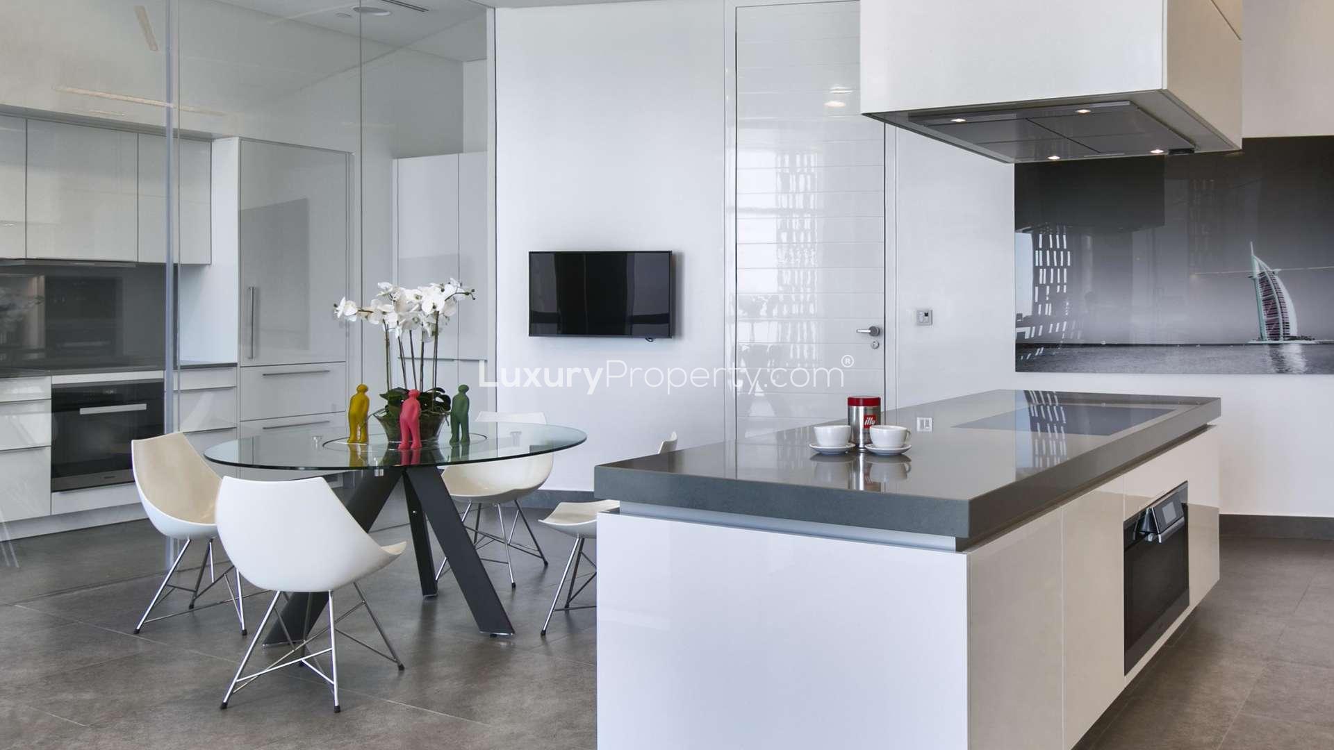 Luxurious dining area with city view in Cayan Tower penthouse, Dubai Marina