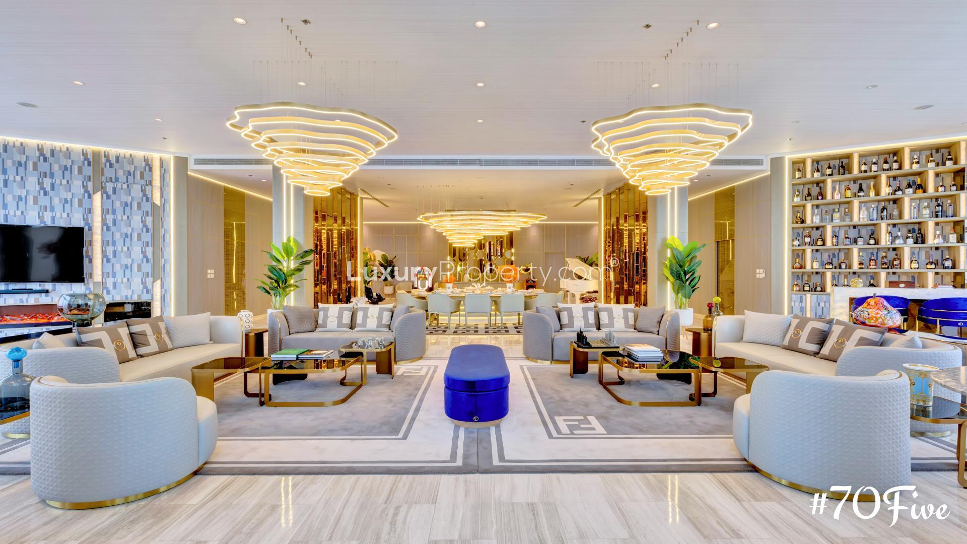 Luxurious D1 Tower penthouse living room with modern decor and Dubai Creek view