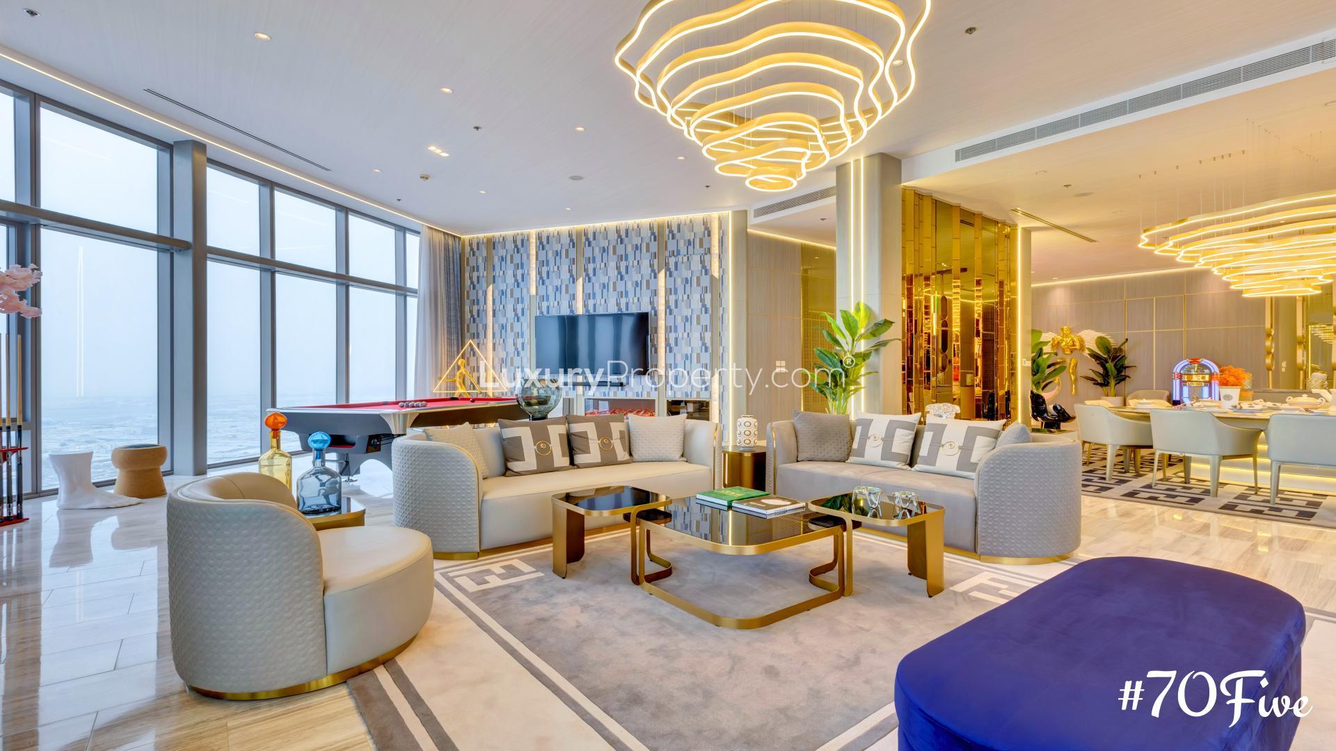Luxurious living room in D1 Tower penthouse with modern decor and Dubai Creek view