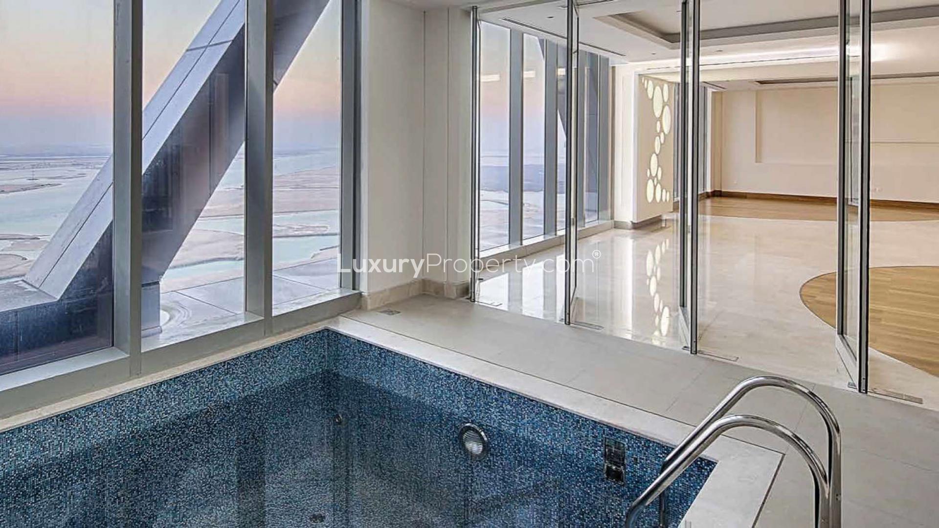 Luxurious penthouse living room with panoramic windows in Shams Abu Dhabi, Al Reem Island