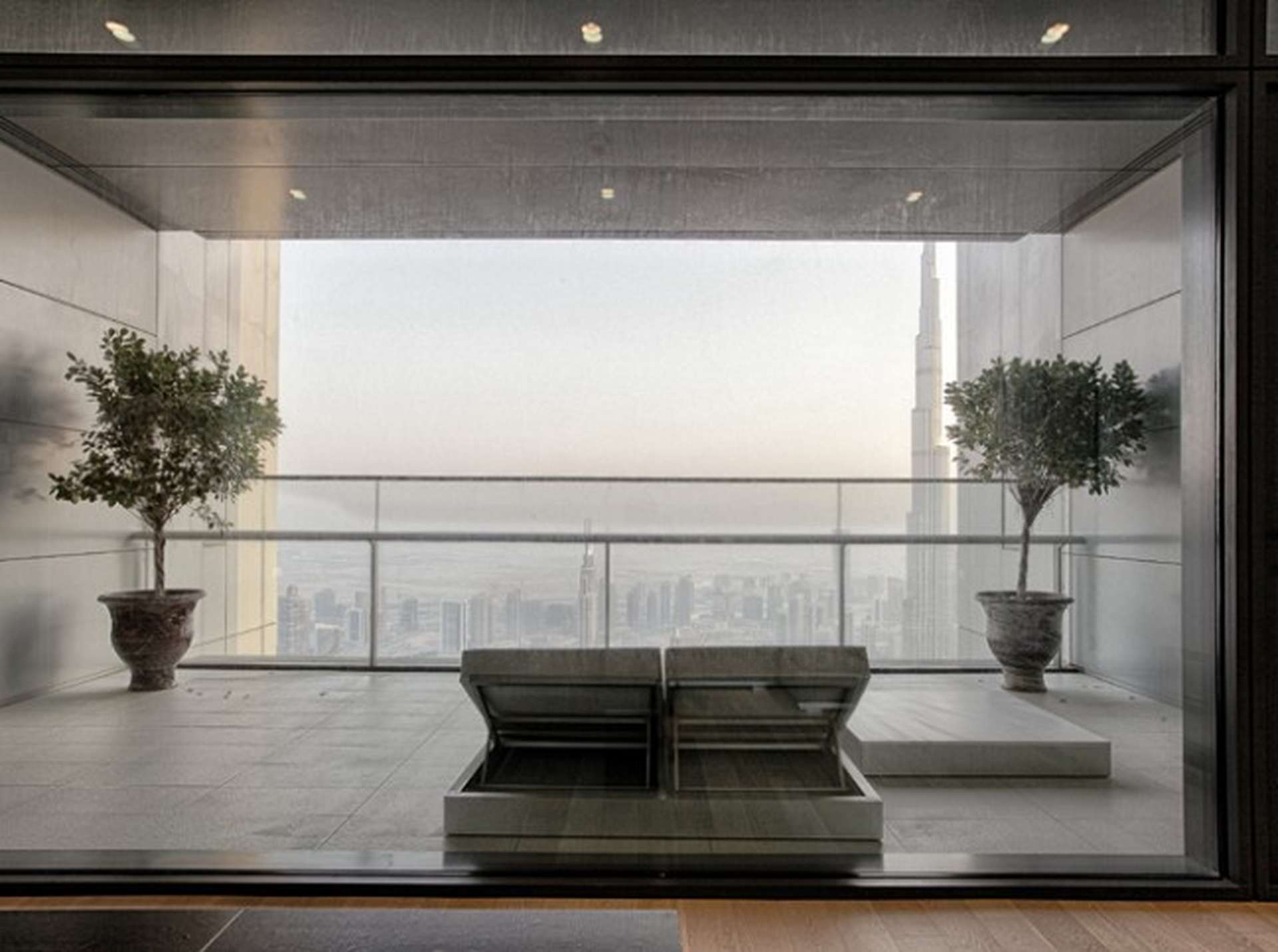 Luxurious penthouse balcony view in Index Tower, DIFC, featuring skyline and Burj Khalifa