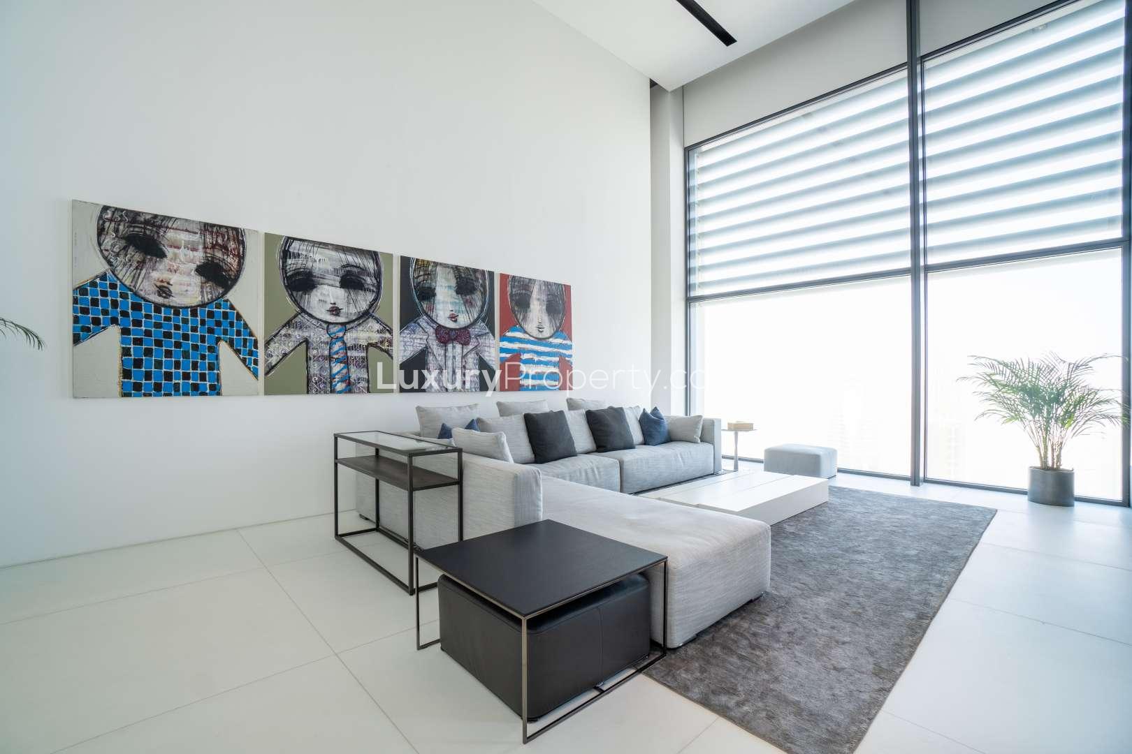 Luxurious living room in Index Tower penthouse, DIFC, featuring modern decor and skyline views