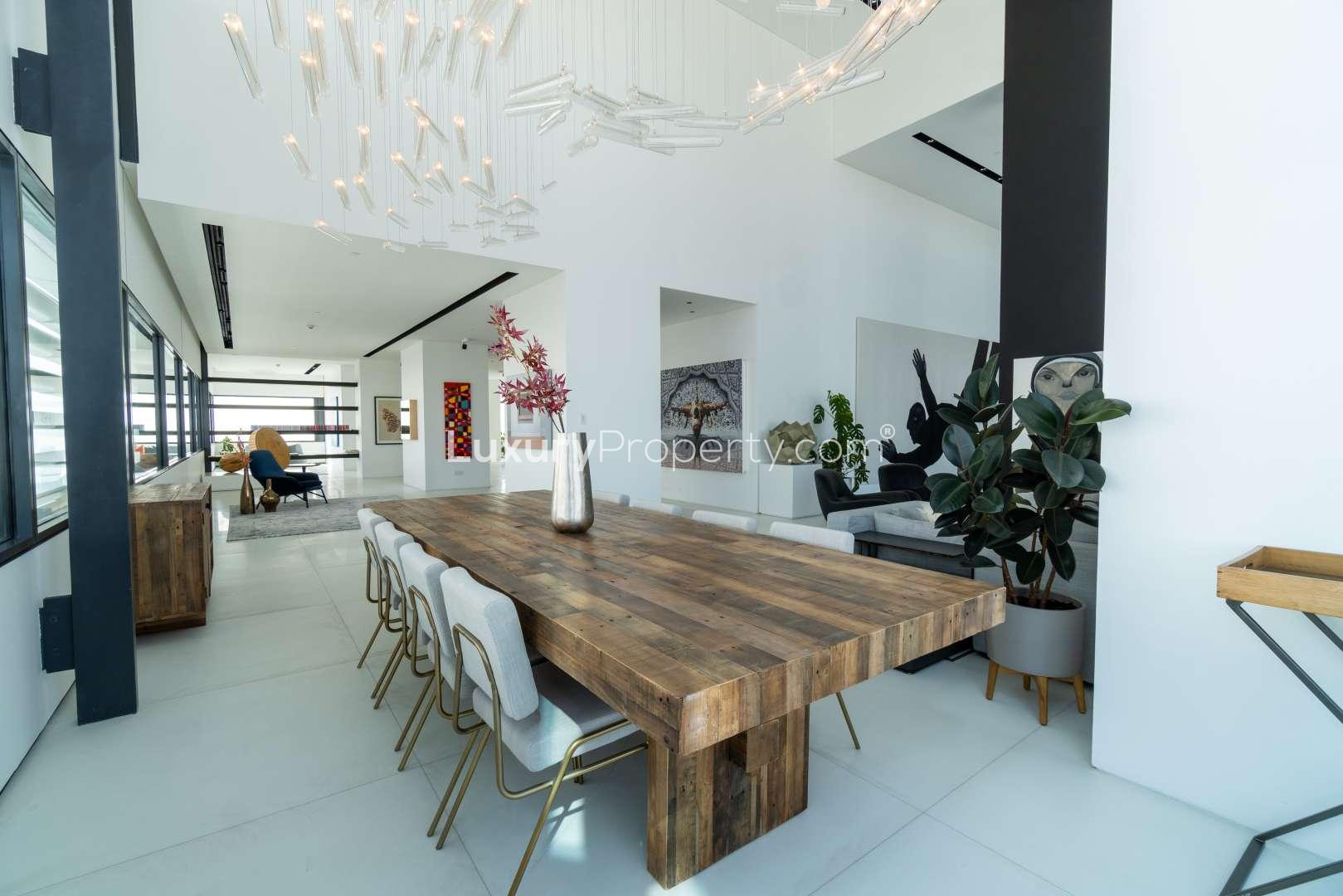 Modern living room in Index Tower penthouse, DIFC with contemporary art and large windows