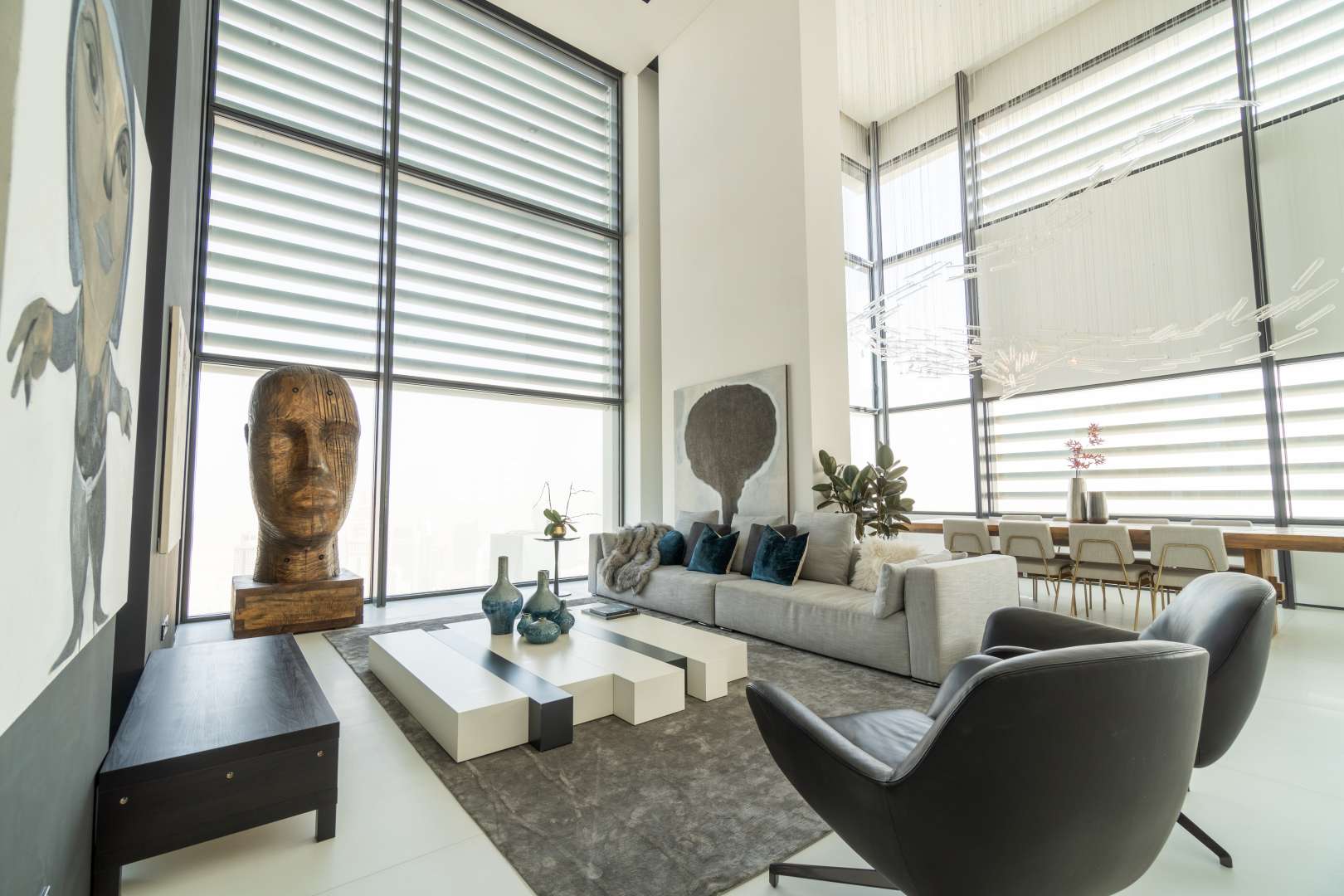 Luxurious living room in DIFC Index Tower penthouse with modern decor and artwork