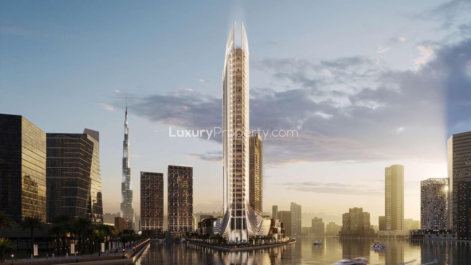 Luxurious penthouse living room with modern decor, spiral staircase, and waterfront view in Business Bay