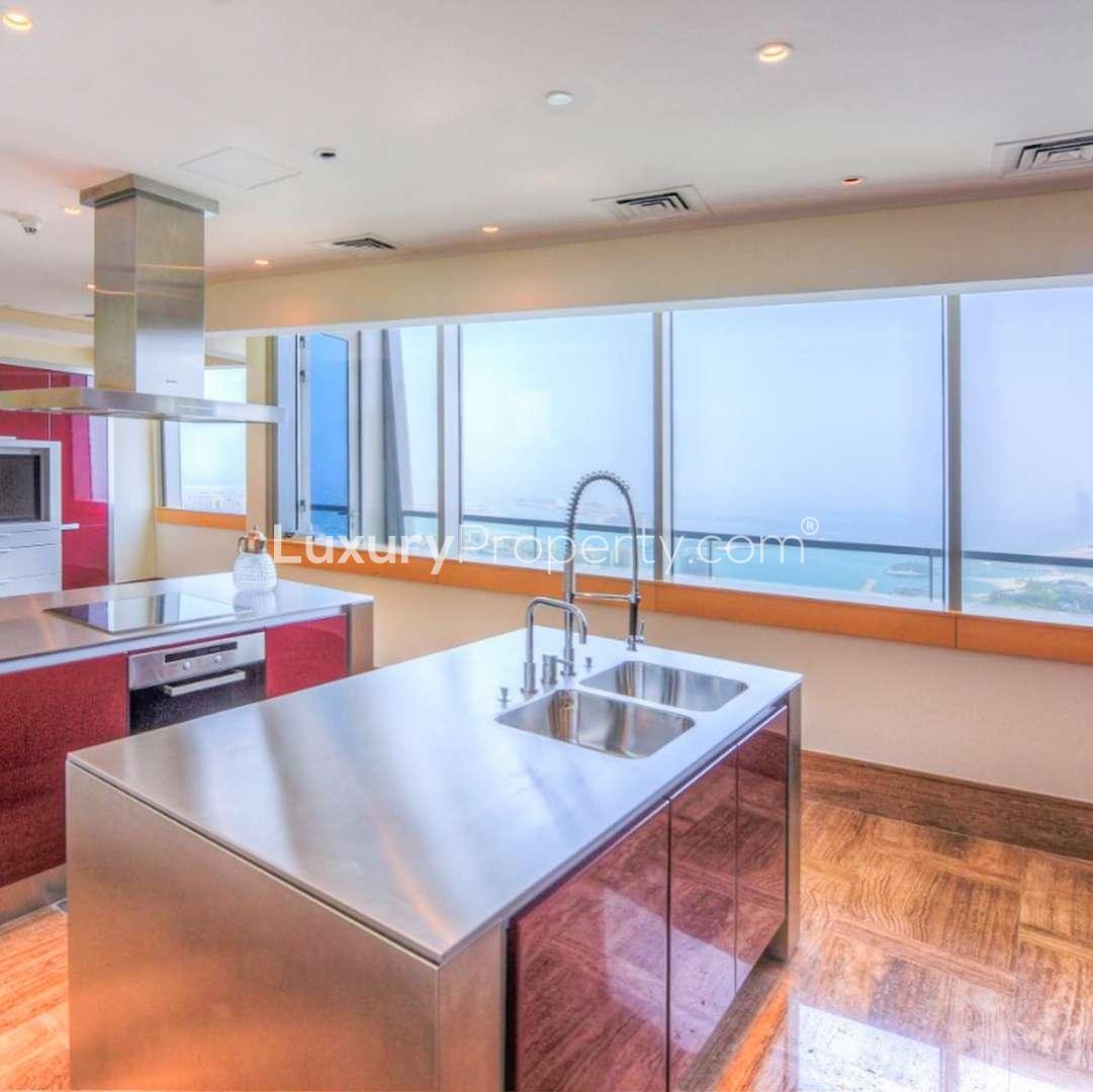 Luxurious Dubai Marina penthouse with panoramic ocean views and elegant interior seating area