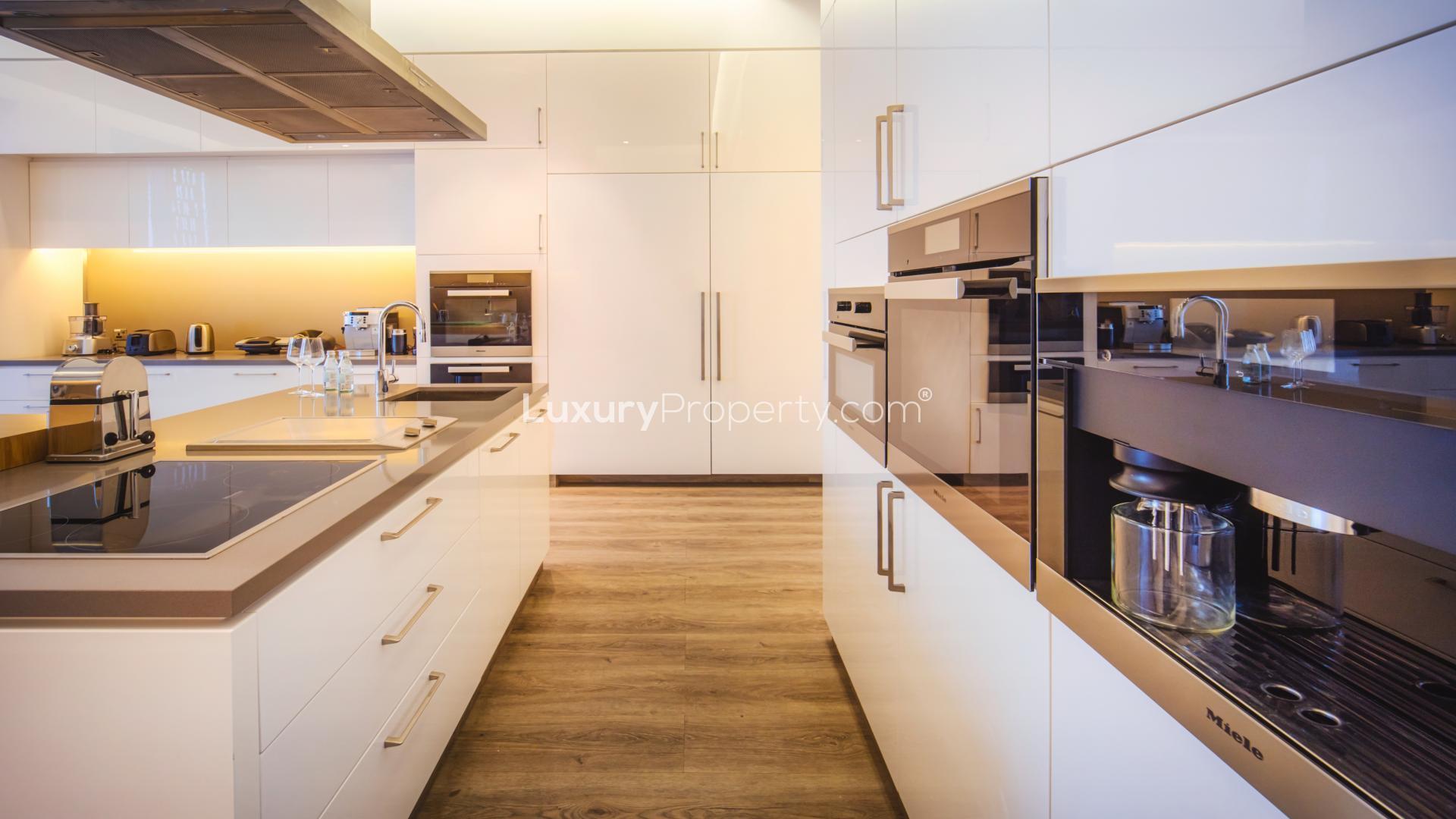 Luxurious living room in 5-bedroom Dubai Marina penthouse, Cayan Tower, with skyline views