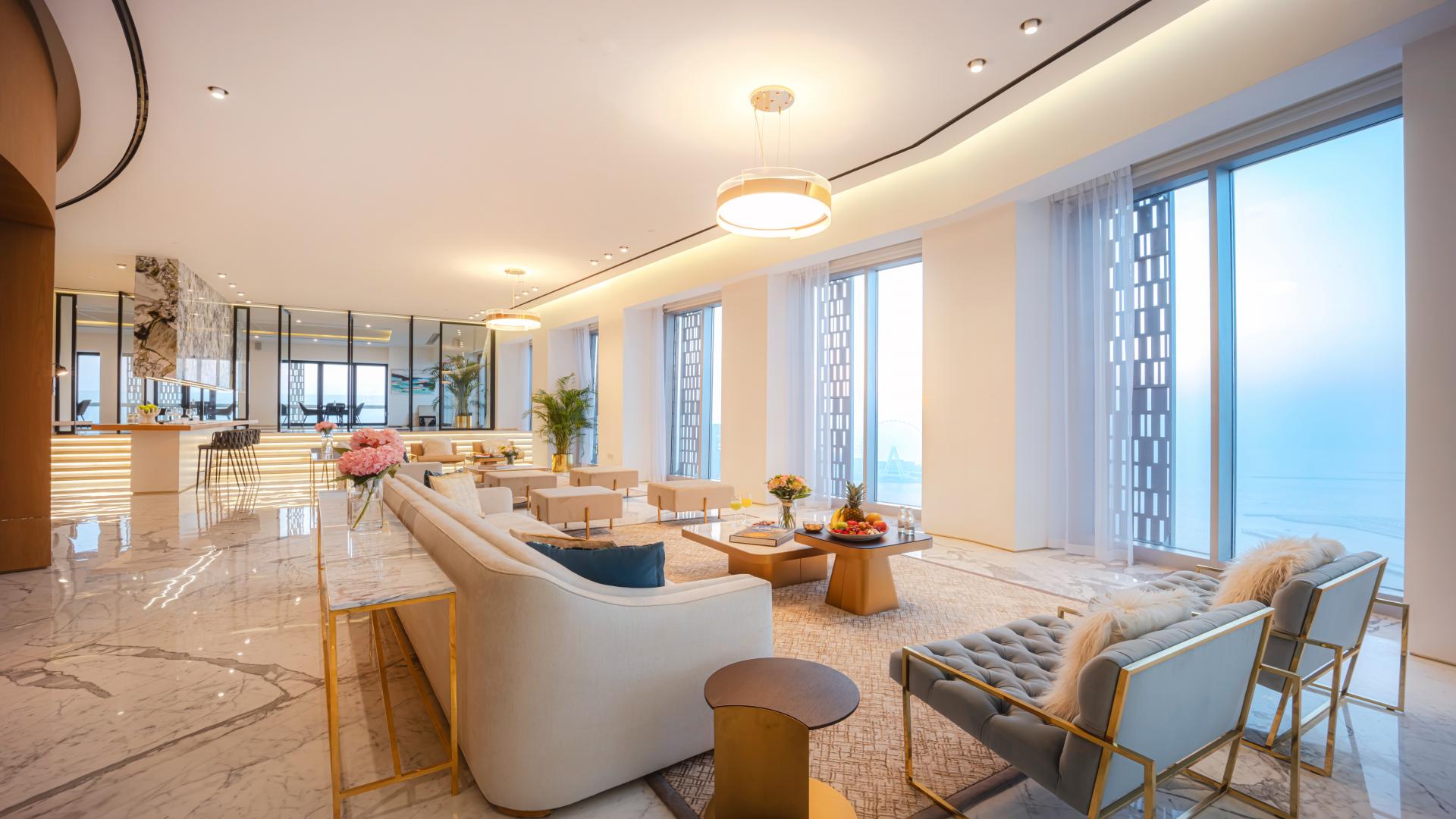 Indoor pool and seating area in luxurious Dubai Marina penthouse, Cayan Tower