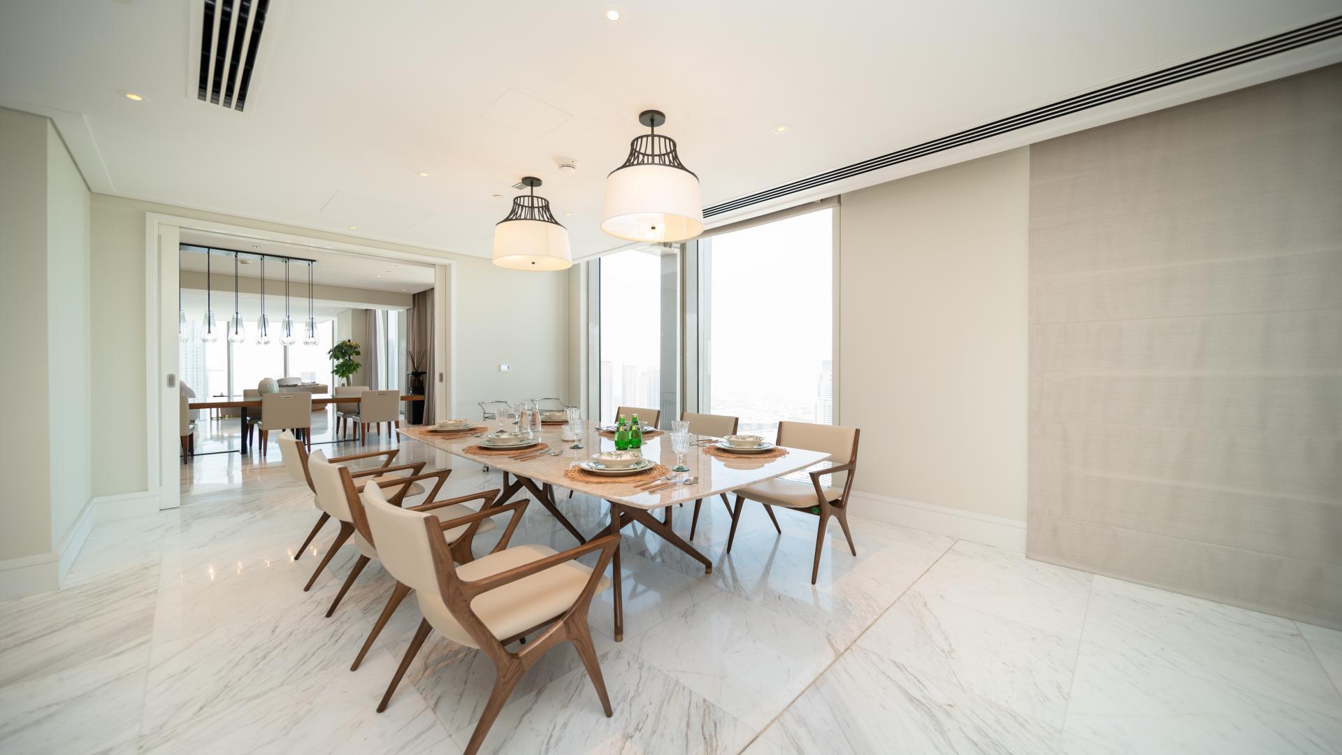 Luxurious penthouse living room in Vida Residence Downtown, featuring modern decor and spacious seating