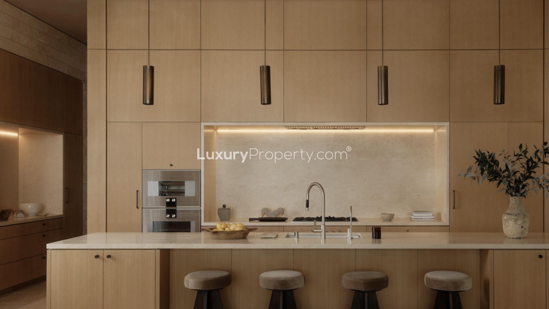 Luxurious West Hollywood living room with elegant sofas and modern art above fireplace