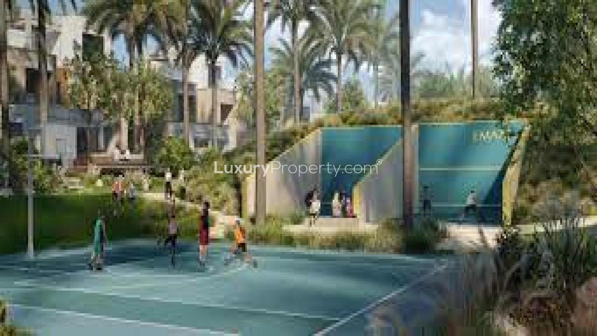 Dining and living area in Arabian Ranches 3 townhouse, featuring modern decor and natural light