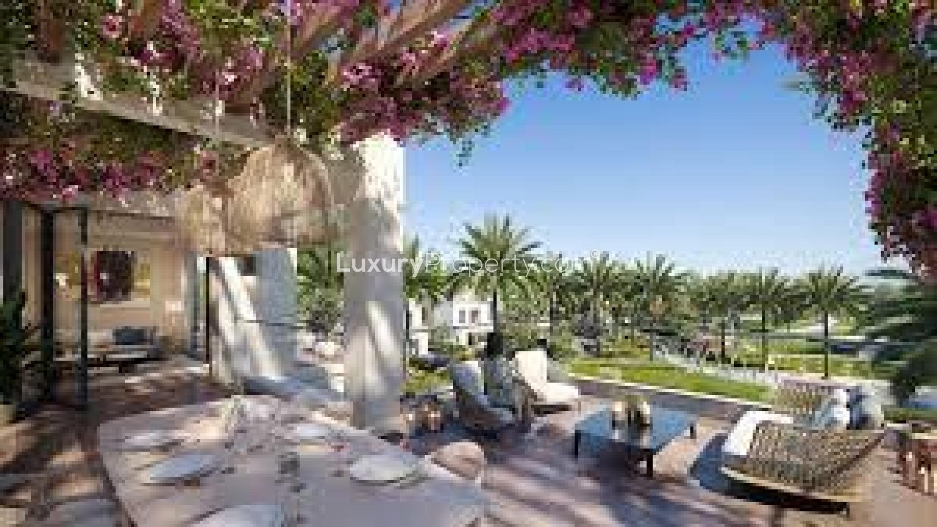 "Community sports court in Arabian Ranches 3, Caya, near spacious 5-bedroom townhouse for sale.",Outdoor seating area in lush garden at Arabian Ranches 3 townhouse, Caya sub-community