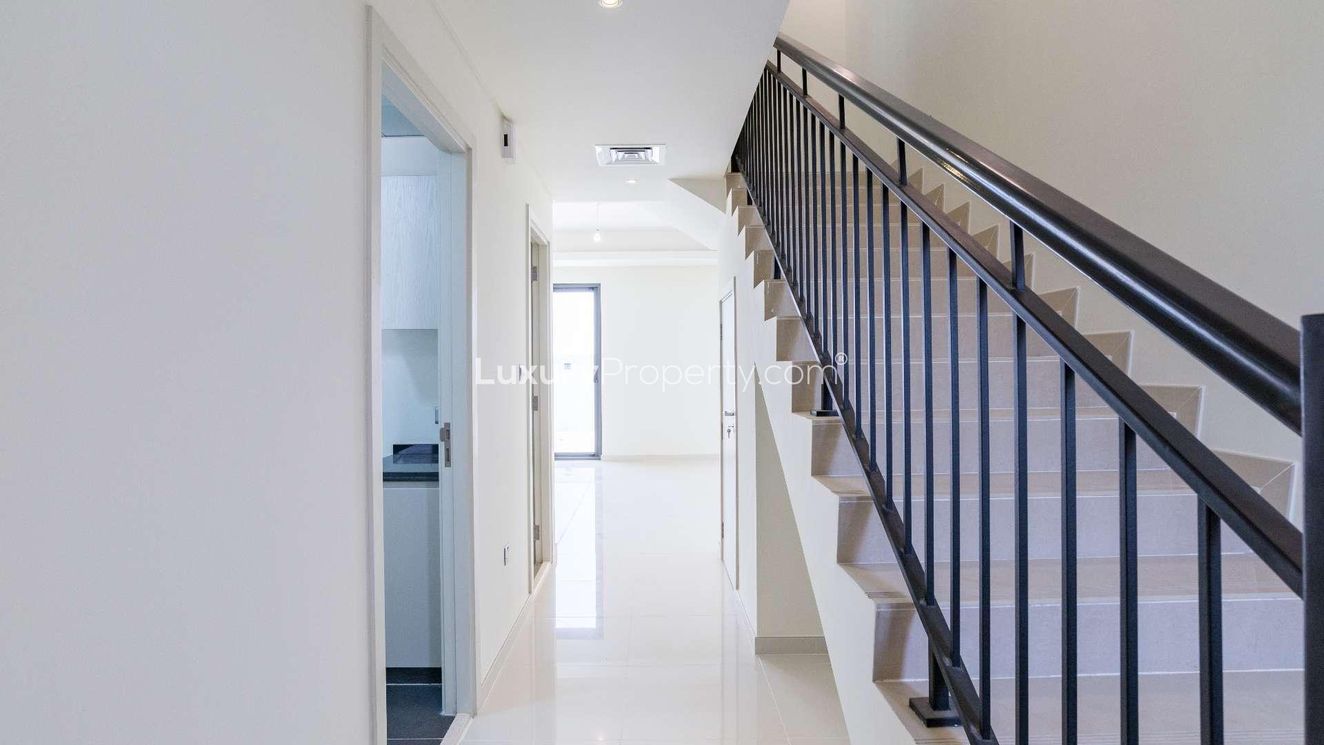 Modern five-bedroom townhouse exterior in Aster, Damac Hills 2, available for rent