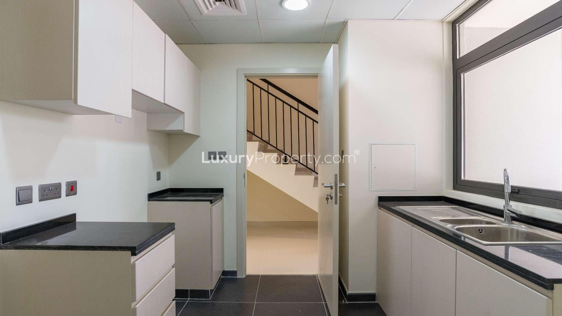 Modern hallway with staircase in five-bedroom townhouse, Aster, Damac Hills 2, available for rent