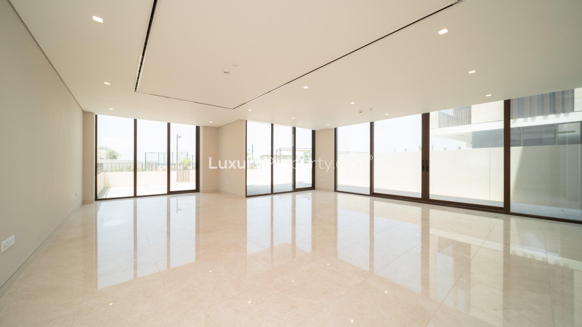 Modern townhouse exterior on Jumeirah Bay Island, featuring sleek architecture and spacious driveway