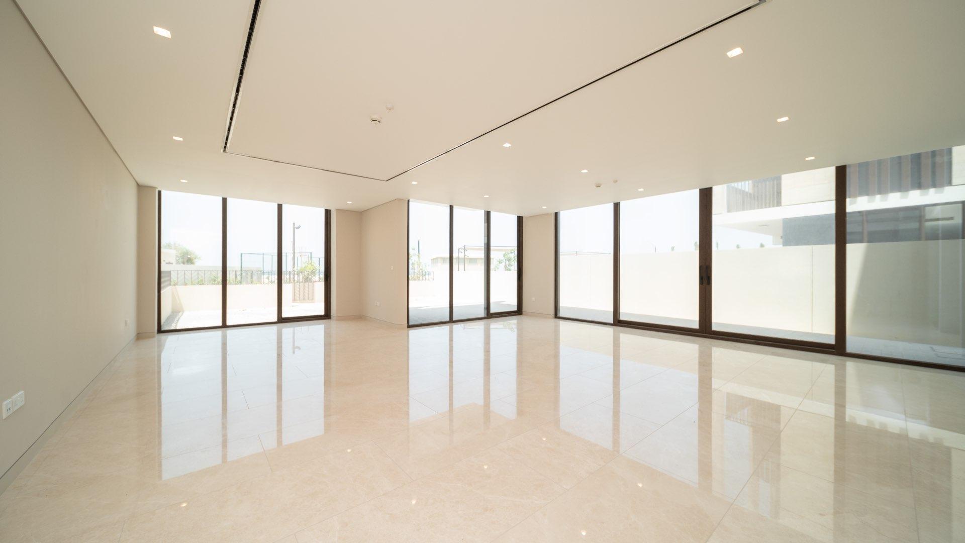 Modern townhouse exterior on Jumeirah Bay Island, featuring sleek architecture and spacious driveway