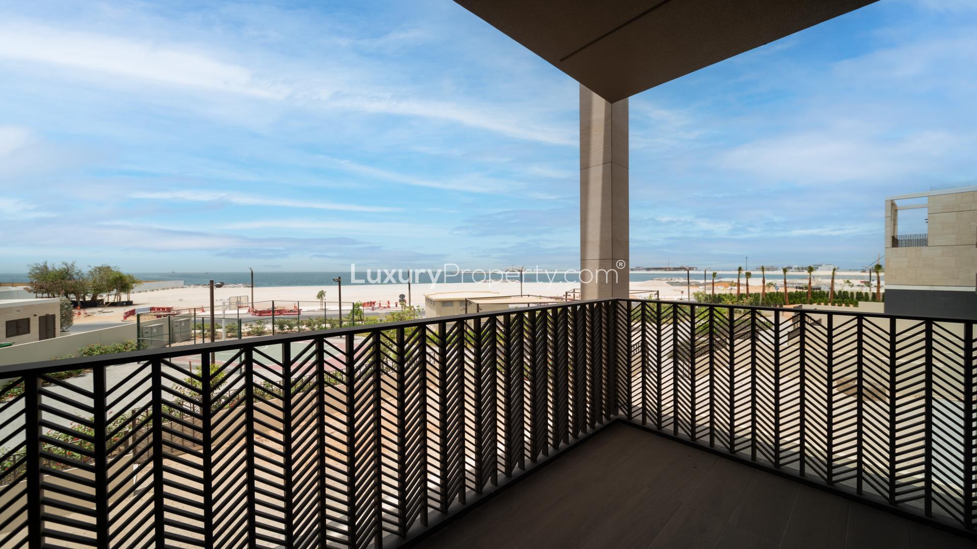 Spacious living area with large windows in Jumeirah Bay Island townhouse for rent