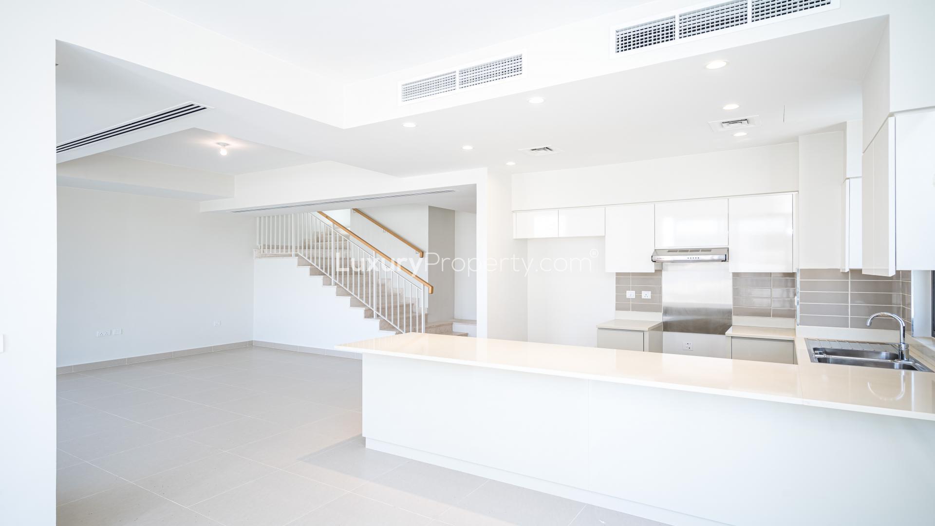 Modern kitchen in Dubai Hills Estate townhouse for rent, featuring sleek white cabinetry