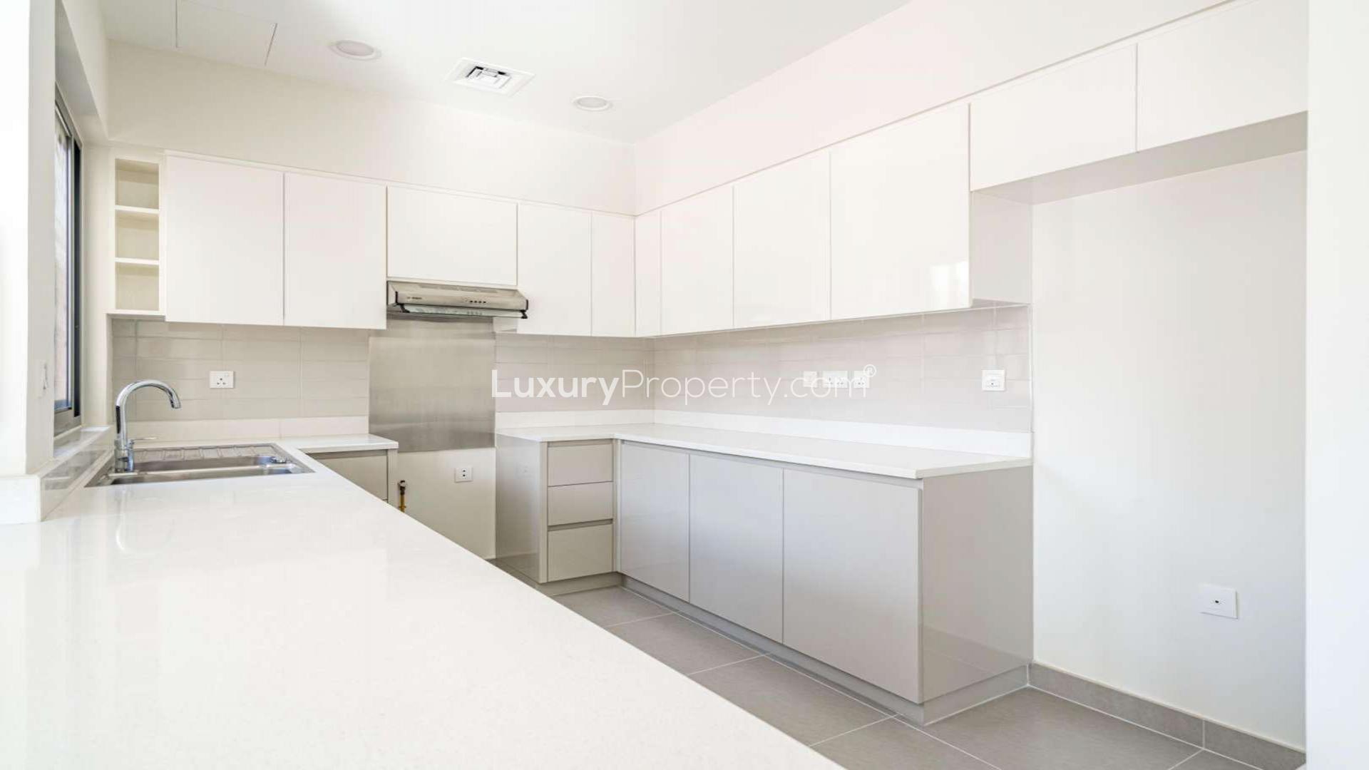 Modern kitchen and open living space in 5-bedroom townhouse, Maple 1, Dubai Hills Estate