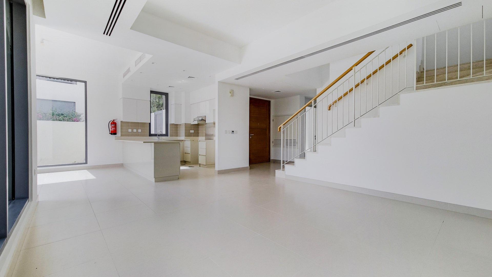 Interior of modern kitchen and living area in Maple 1 townhouse, Dubai Hills Estate
