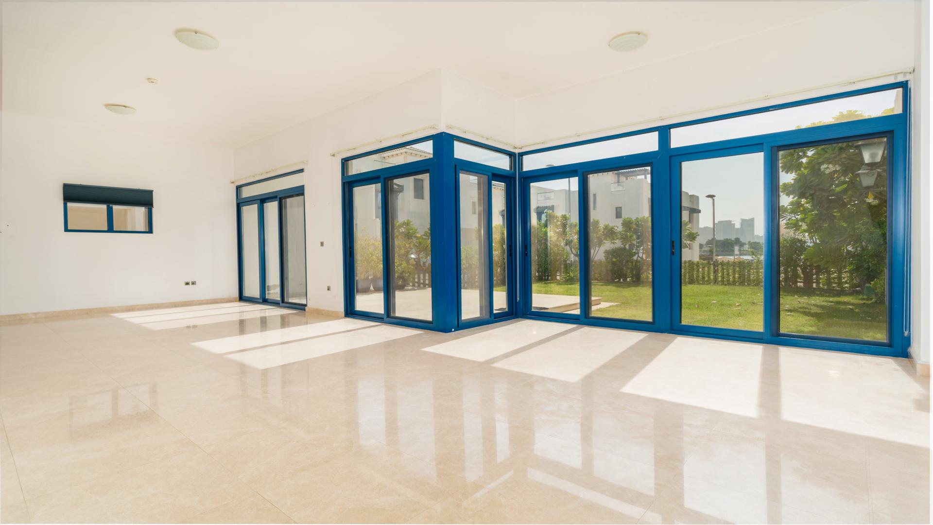 Bright living area with large windows in Palma Residences beachfront townhouse, Palm Jumeirah