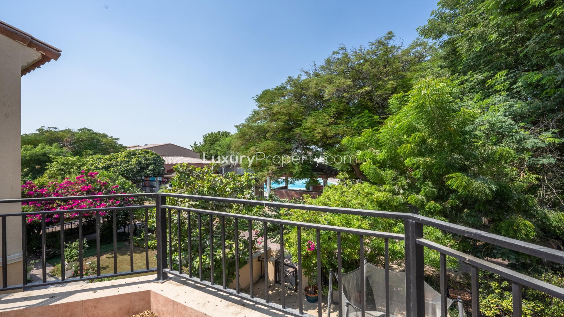 Renovated townhouse living room with high ceilings and natural light in Green Community East