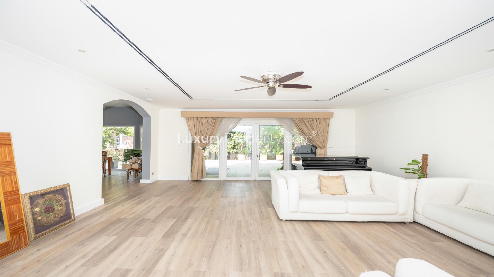 Renovated townhouse exterior with carport in Green Community East, available for rent