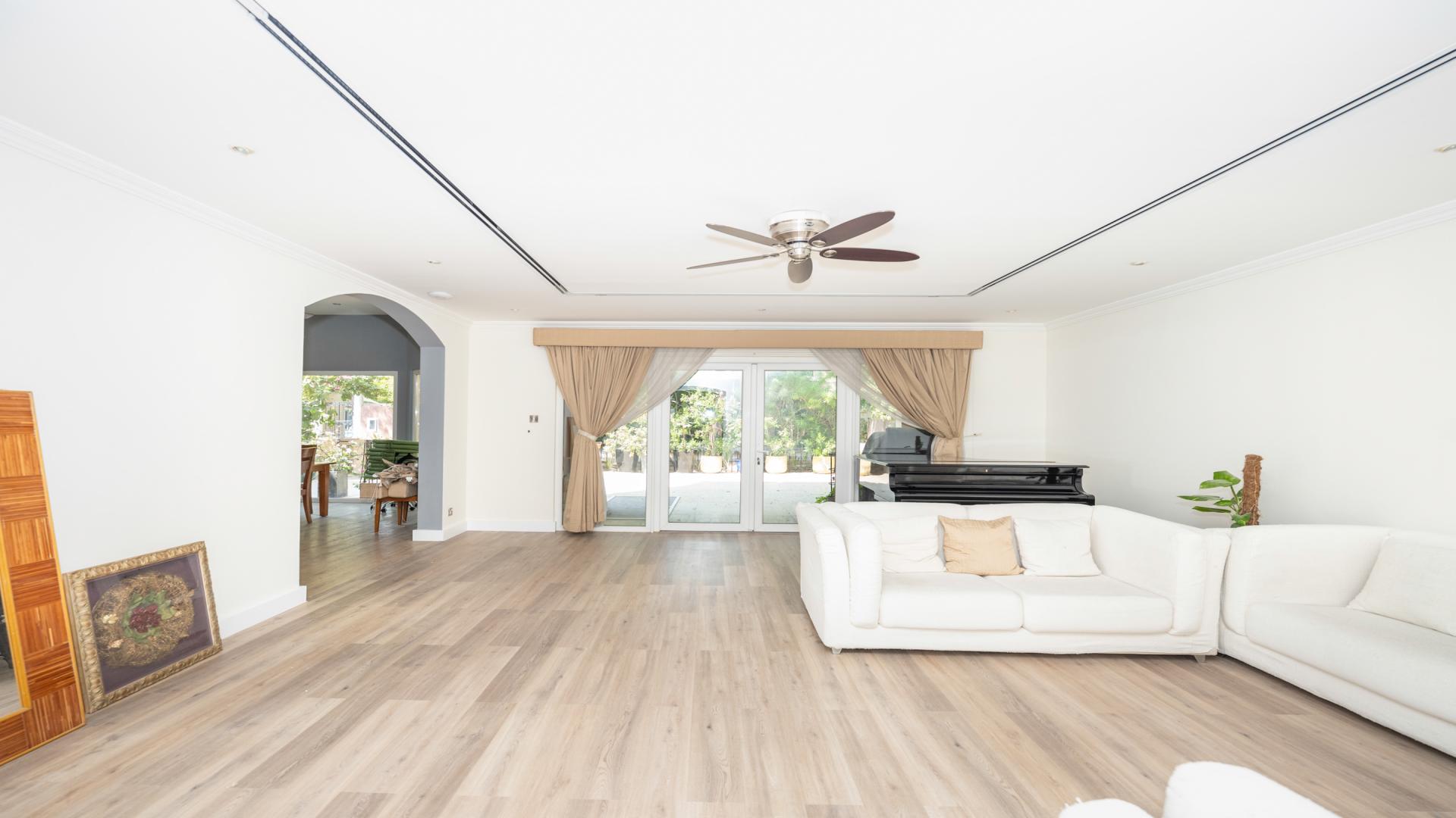 Renovated townhouse exterior with carport in Green Community East, available for rent