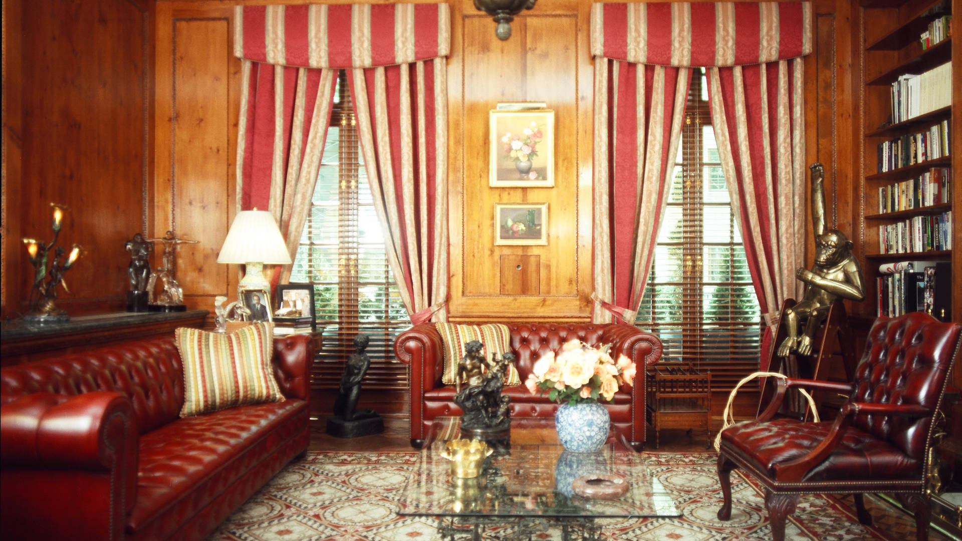Luxurious living room in Manhattan townhouse with wood paneling and leather furniture