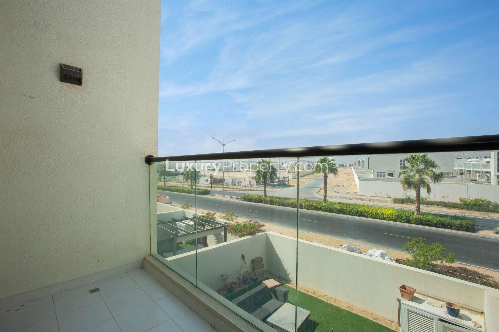 Modern 5-bedroom townhouse exterior with patio in Amazonia, Akoya Dubai for sale