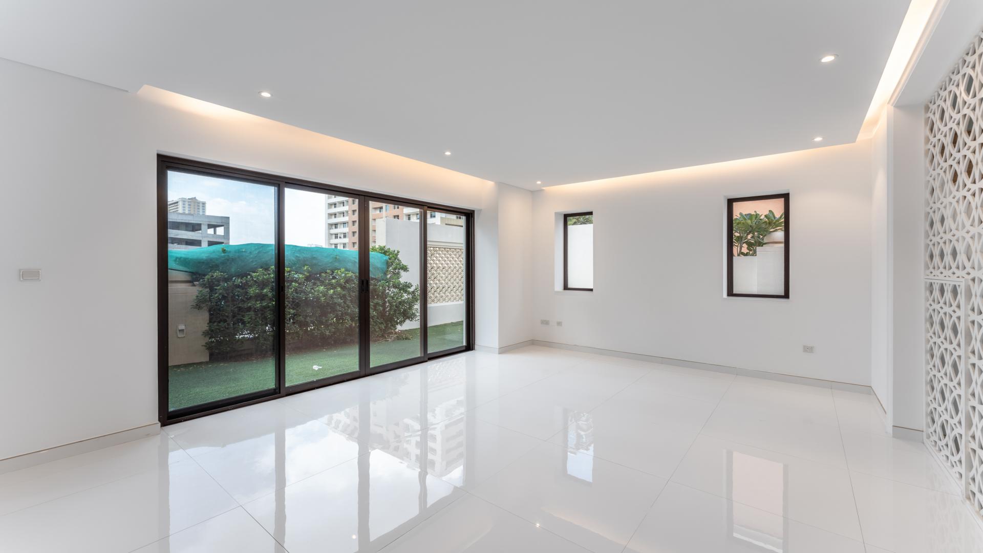 Upgraded 5-bedroom townhouse exterior in gated Bloomingdale, Dubai Sports City for sale