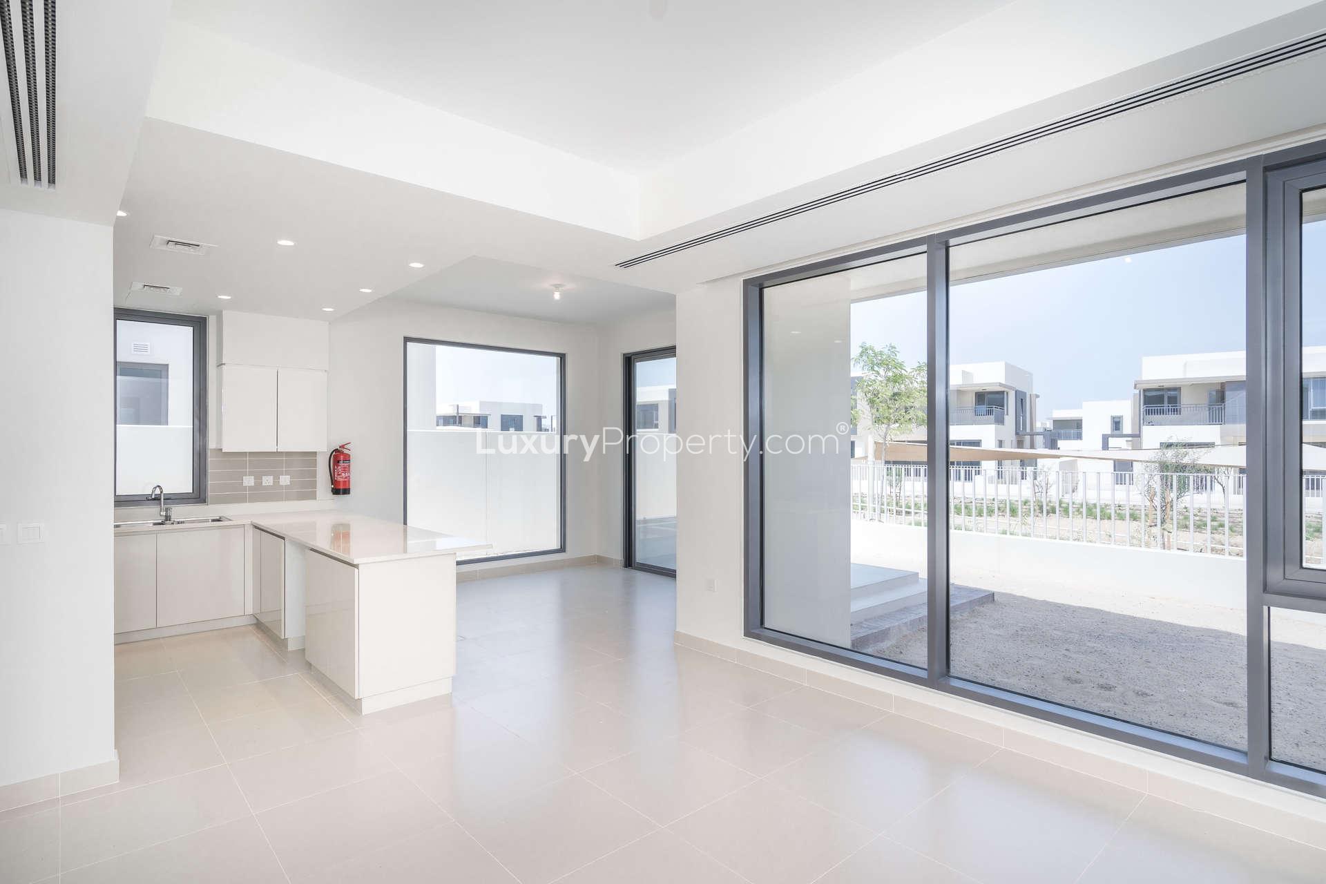 Empty bedroom with large windows and built-in wardrobe in Dubai Hills Estate townhouse