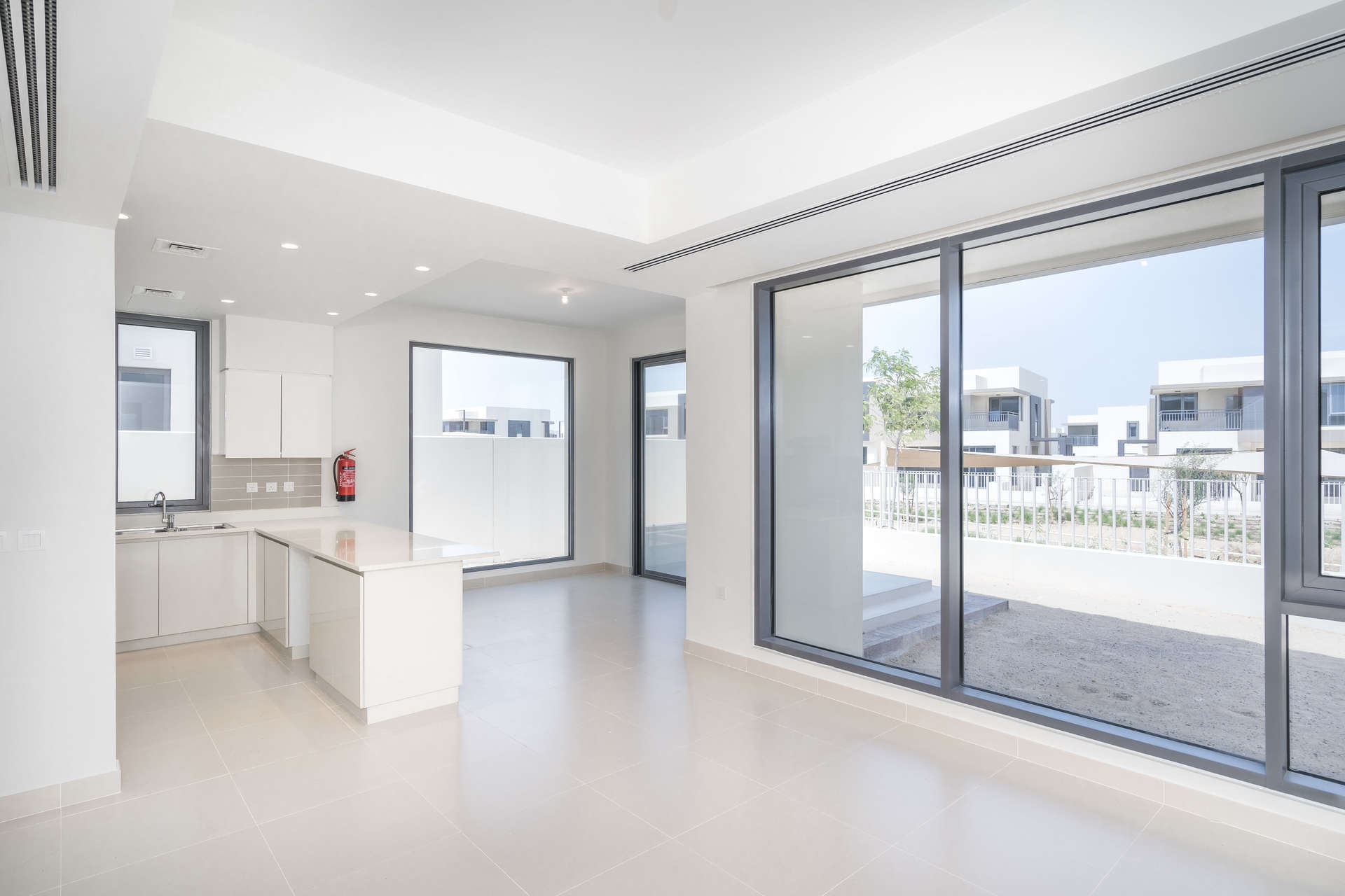 Empty bedroom with large windows and built-in wardrobe in Dubai Hills Estate townhouse