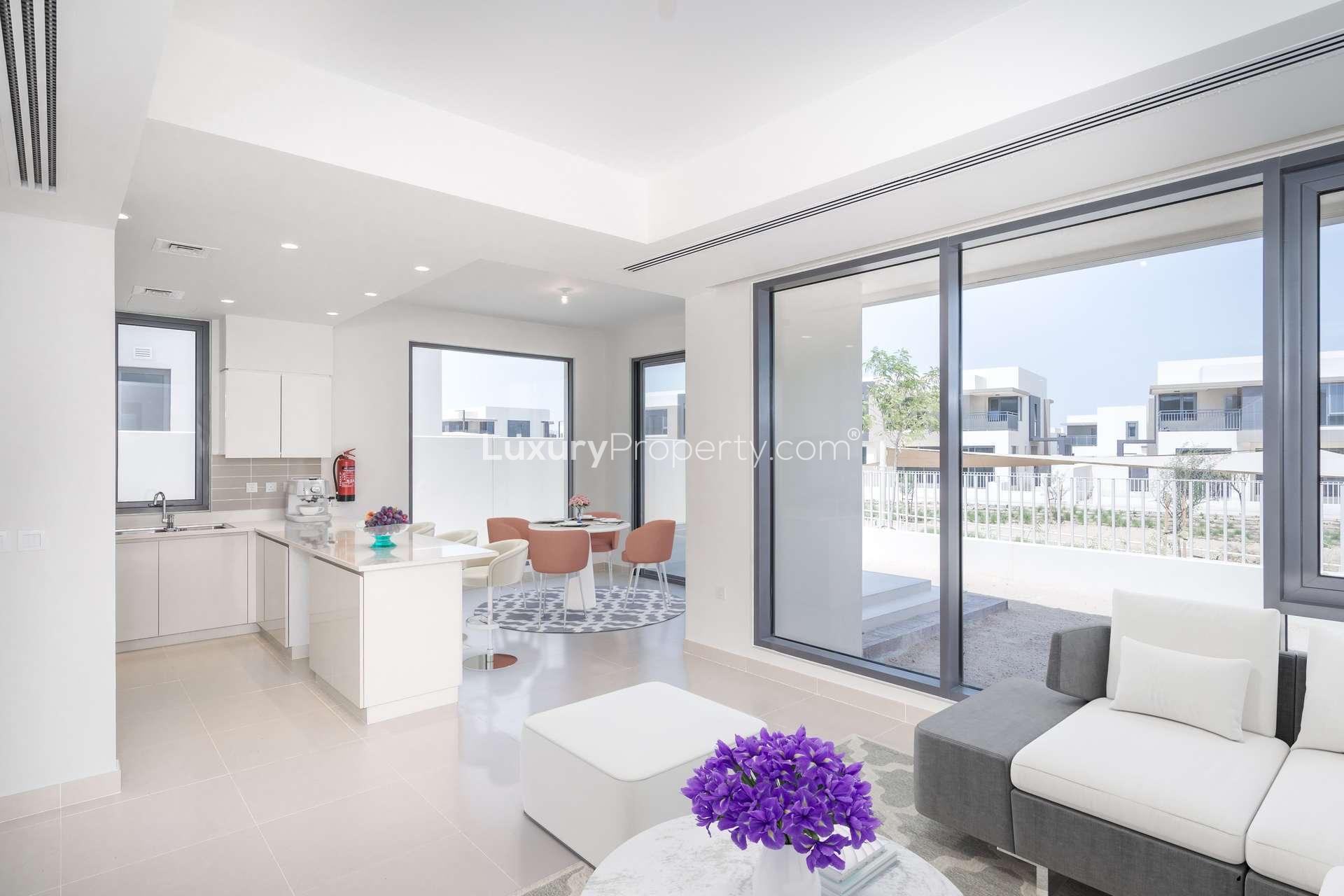 Modern living room in Maple Townhome, Dubai Hills Estate with stylish decor and staircase