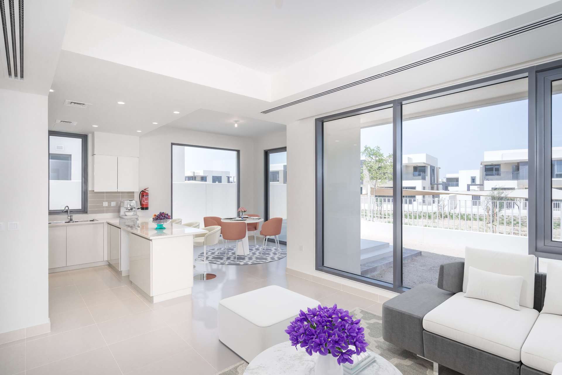 Modern living room in Maple Townhome, Dubai Hills Estate with stylish decor and staircase