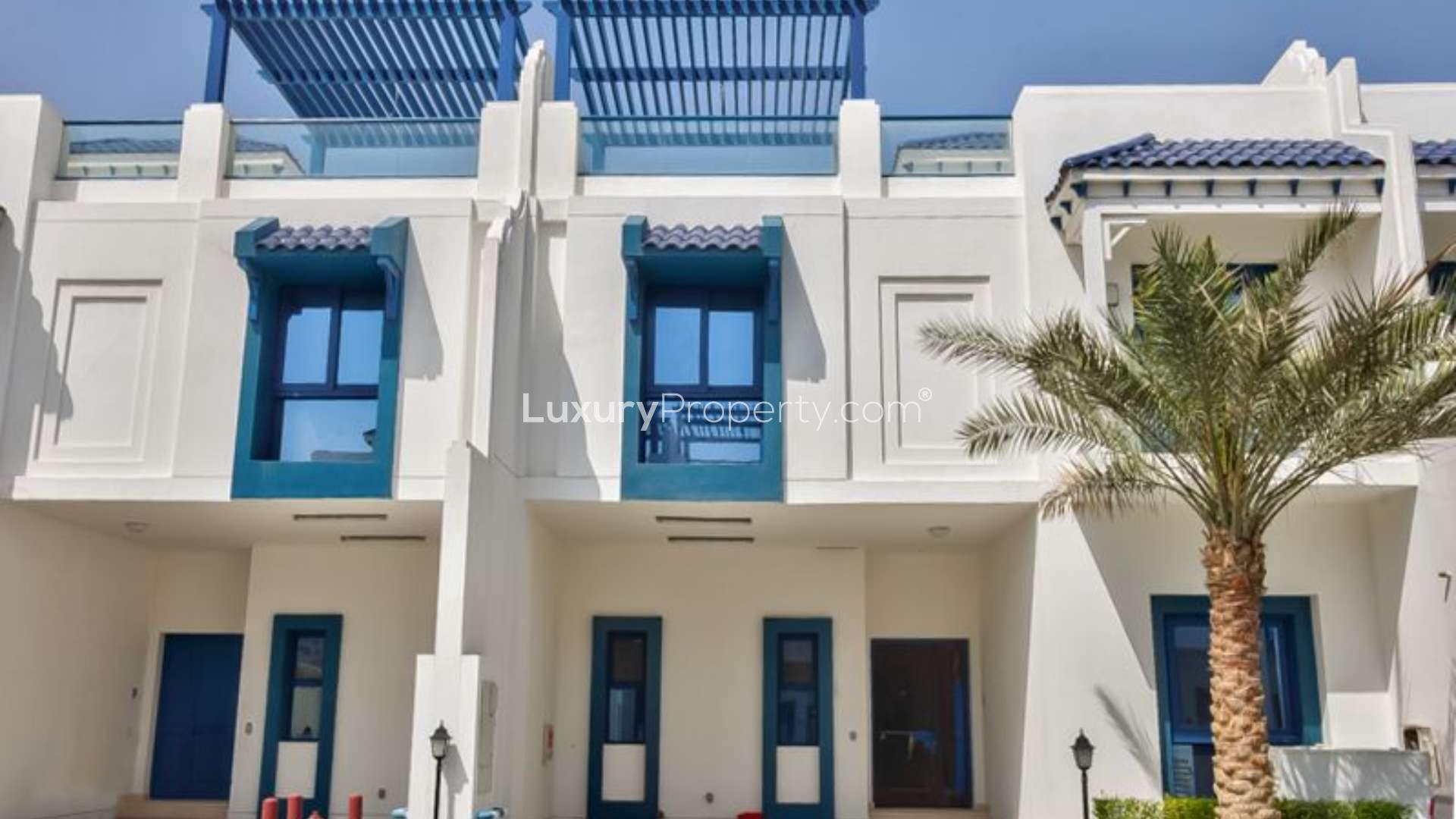 Townhouse exterior at Palma Residences, Palm Jumeirah; modern design with palm tree view
