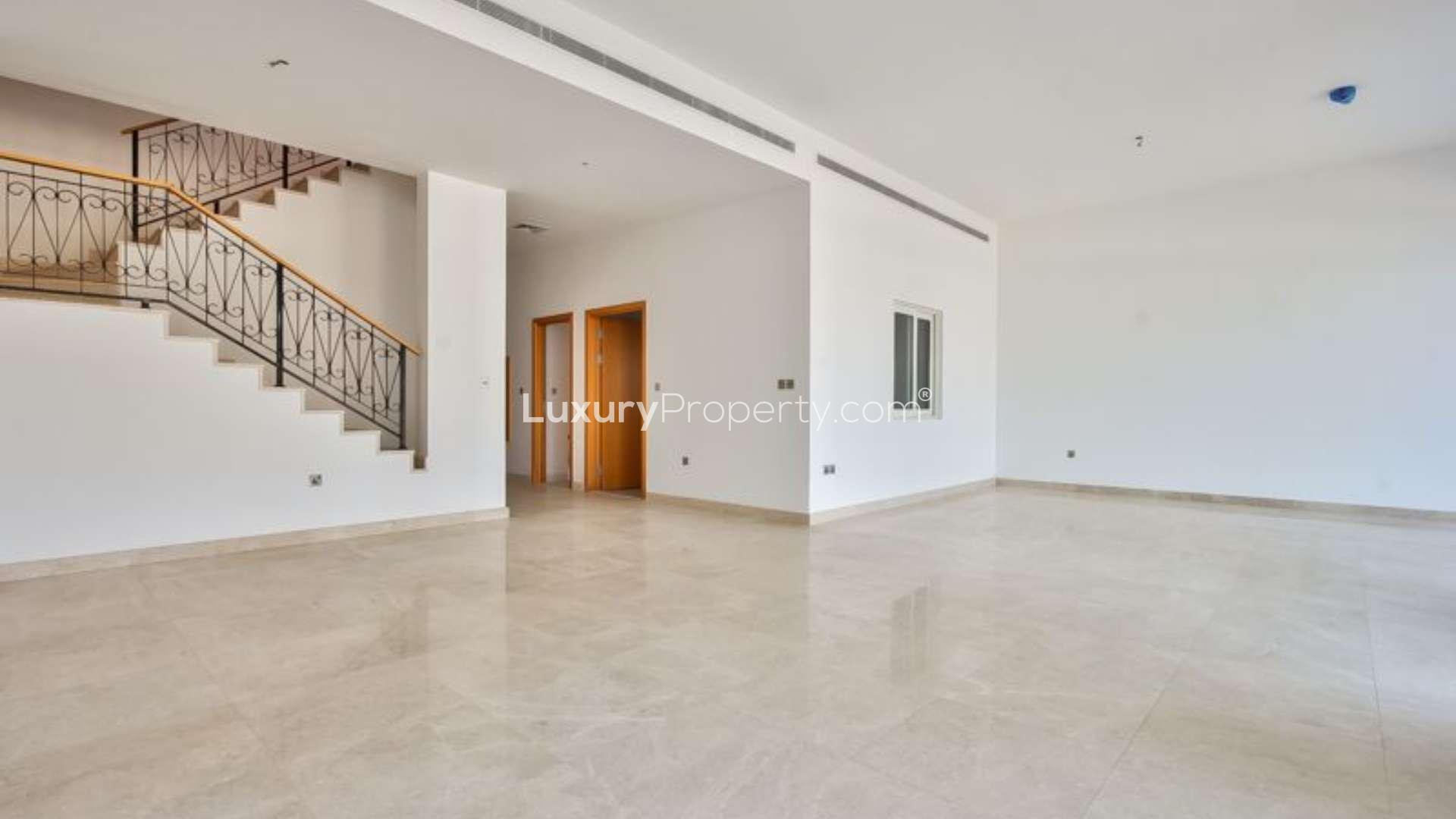 Open-plan living area with staircase in Palma Residences villa, Palm Jumeirah
