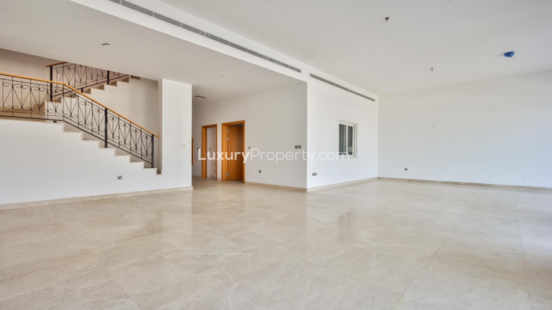 Beachfront view from Palma Residences townhouse, Palm Jumeirah, with skyline in the distance