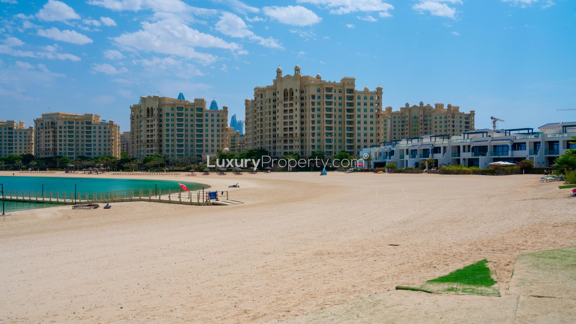 Modern kitchen with wooden cabinets in 5-bedroom Palm Jumeirah villa for sale