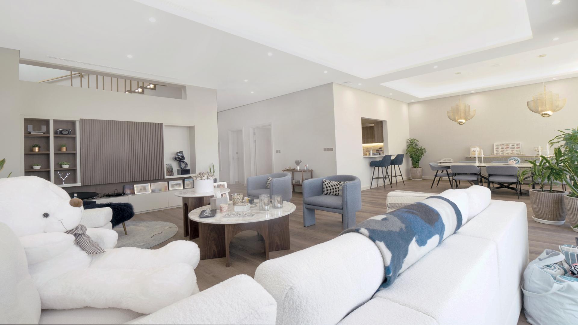 Palm Jumeirah townhouse garden with modern seating, overlooking Burj Al Arab, Palma Residences