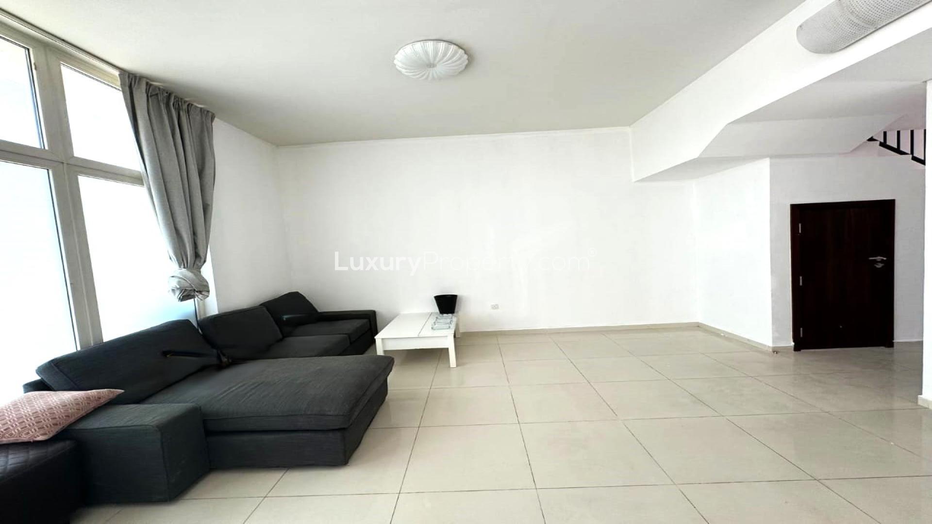 Modern living room in 5-bedroom townhouse, The Roots, Damac Hills 2, for sale