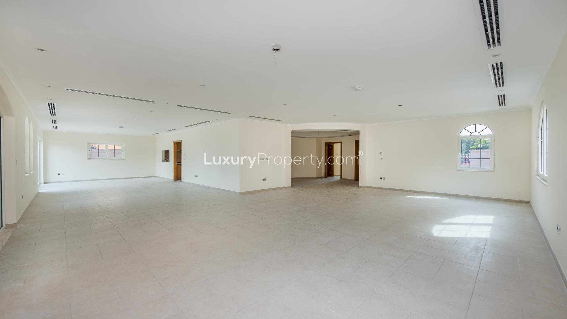 Spacious living area in 4-bedroom Legacy Villa, Jumeirah Park, Dubai, with large windows
