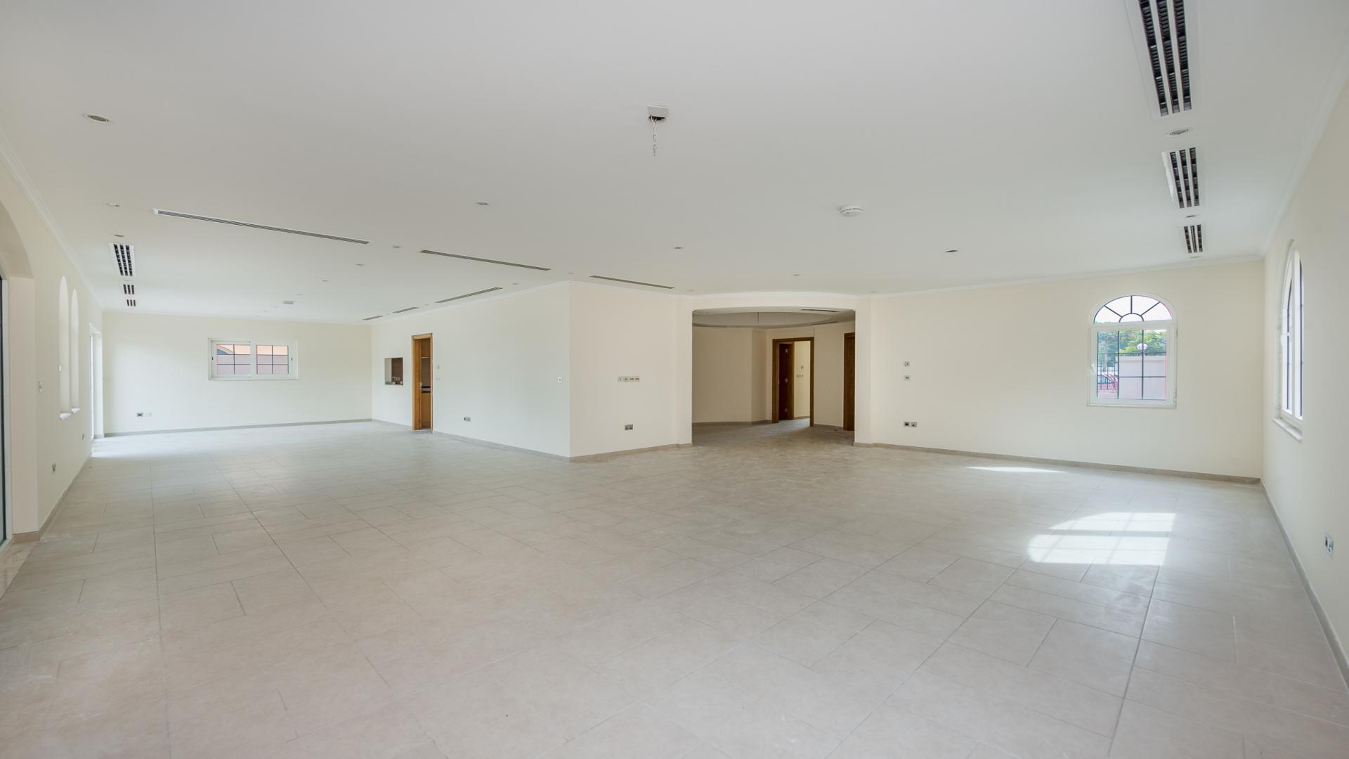 Spacious living area in 4-bedroom Legacy Villa, Jumeirah Park, Dubai, with large windows