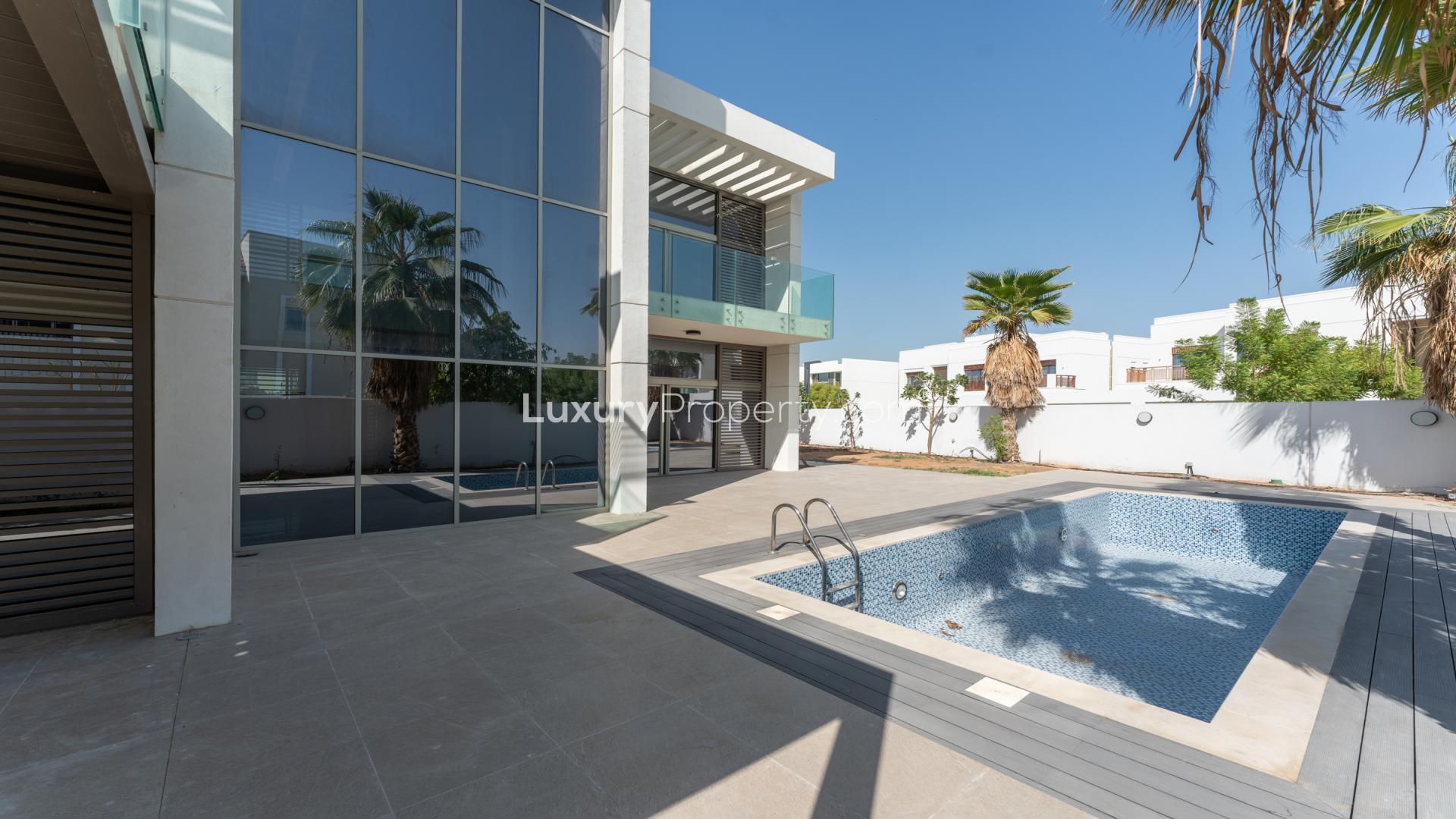 Modern villa balcony with glass railing in District One, Mohammed Bin Rashid City