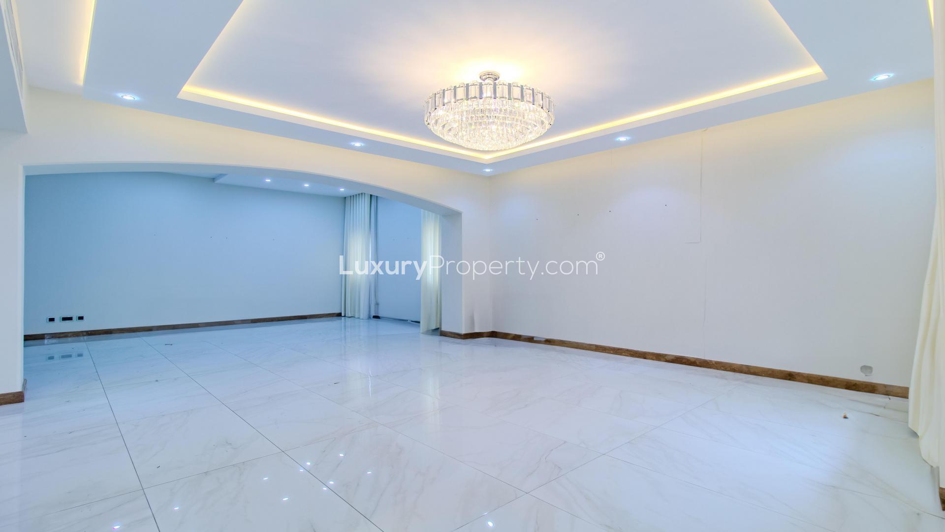 Spacious living room with chandelier in upgraded Meadows villa for rent, LP40176