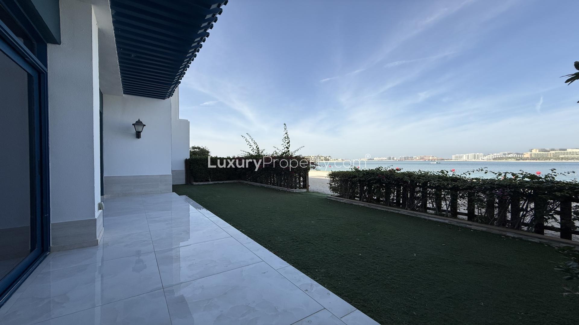 Luxurious villa interior with spacious living area and large windows in Palma Residences